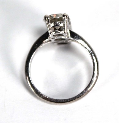 Lot 800 - An 18ct white gold ring set three graduated...