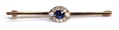 Lot 780 - A 9ct yellow gold bar brooch set a sapphire,...