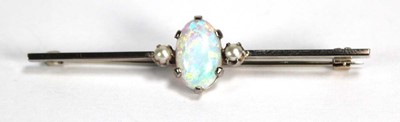 Lot 782 - A white metal bar brooch set oval opal and two...