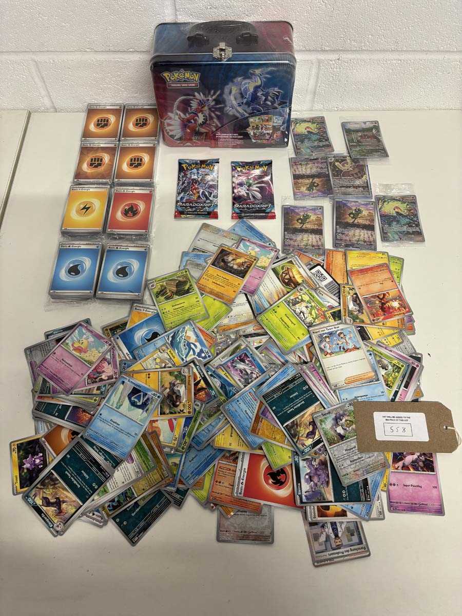 Lot Quantity of Pokémon cards, packs and a Tin...