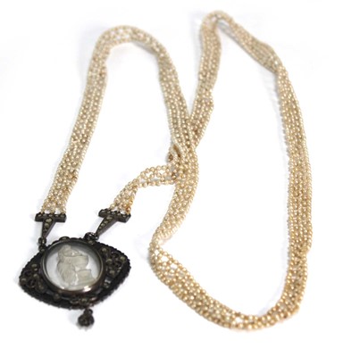 Lot 792 - A plaited seed pearl necklace suspending a...