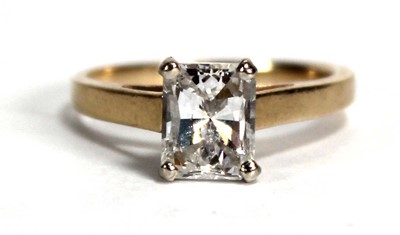 Lot 799 - An 18ct yellow gold ring set rectangular cut...