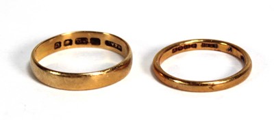 Lot 801 - Two 22ct yellow gold wedding bands, London...