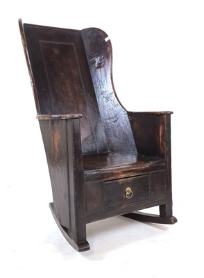 Lot 7 - An 18th century lambing chair, the wingback...