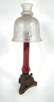 Lot 181 - A Victorian brass oil lamp with a ruby red...