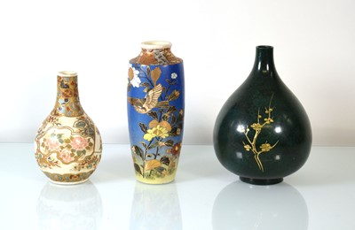Lot 201 - A Japanese bottle vase decorated with birds...