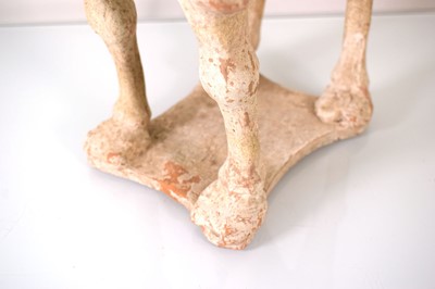 Lot 202 - A Chinese pottery figure modelled as a...