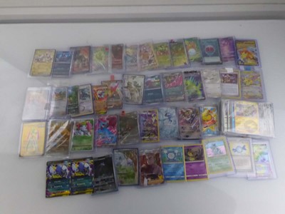 Lot Qty of Sleeved and top loaded Pokémon cards...