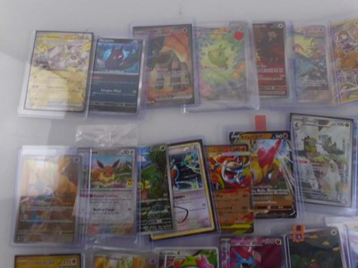 Lot Qty of Sleeved and top loaded Pokémon cards...