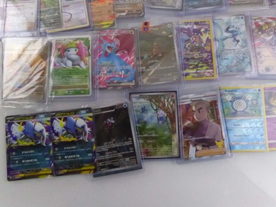 Lot Qty of Sleeved and top loaded Pokémon cards...
