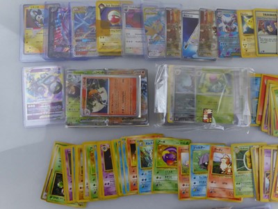 Lot Qty of Sleeved and top loaded Pokémon cards...