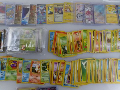 Lot Qty of Sleeved and top loaded Pokémon cards...