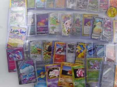 Lot Qty of Sleeved and top loaded Pokémon cards...