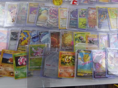 Lot Qty of Sleeved and top loaded Pokémon cards...