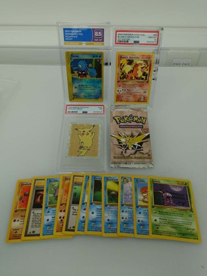 Lot Three assorted graded Pokémon cards/stickers...