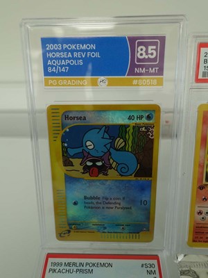 Lot Three assorted graded Pokémon cards/stickers...