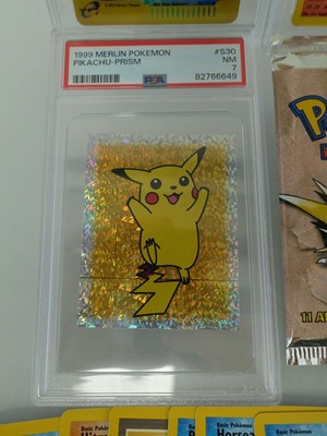 Lot Three assorted graded Pokémon cards/stickers...
