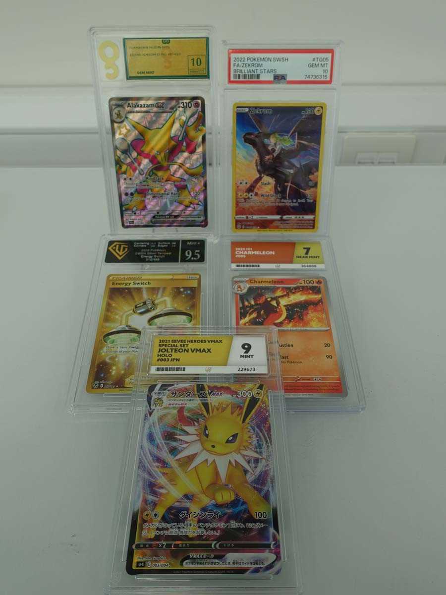 Lot Five assorted graded Pokémon cards to include...