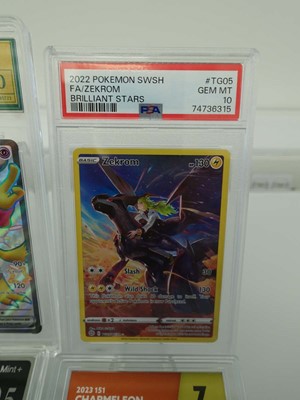 Lot Five assorted graded Pokémon cards to include...