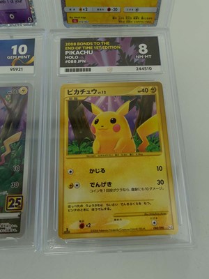 Lot Four assorted graded Pokémon cards to include...