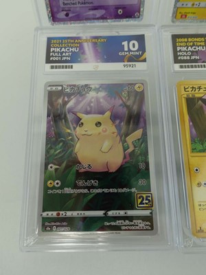 Lot Four assorted graded Pokémon cards to include...