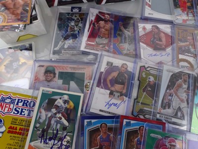 Lot Qty of Sleeved/Top Loaded Sports Trading cards...