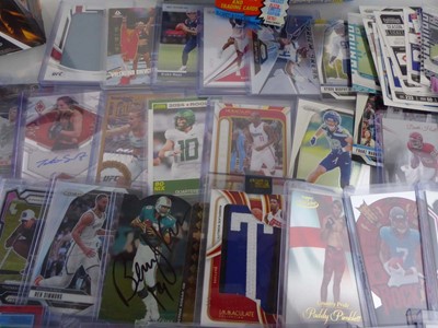 Lot Qty of Sleeved/Top Loaded Sports Trading cards...