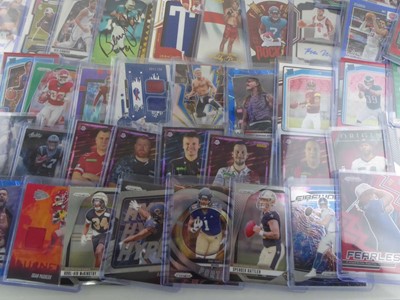 Lot Qty of Sleeved/Top Loaded Sports Trading cards...