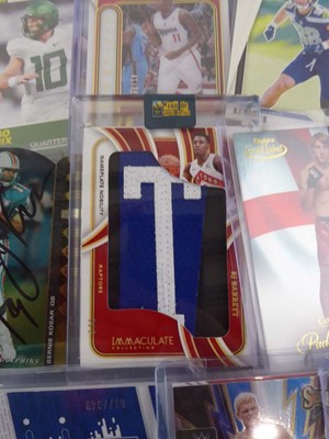 Lot Qty of Sleeved/Top Loaded Sports Trading cards...