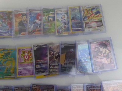 Lot Qty of Sleeved/Top Loaded Pokémon Trading Cards