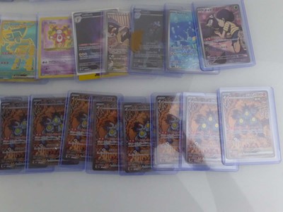 Lot Qty of Sleeved/Top Loaded Pokémon Trading Cards
