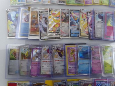 Lot Qty of Sleeved/Top Loaded Pokémon Trading Cards