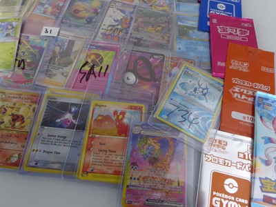 Lot Qty of Assorted Top Loaded Pokémon cards to...