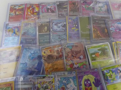 Lot Qty of Assorted Top Loaded Pokémon cards to...