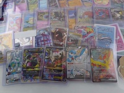Lot Qty of Assorted Top Loaded Pokémon Cards to...