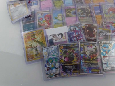Lot Qty of Assorted Top Loaded Pokémon Cards to...