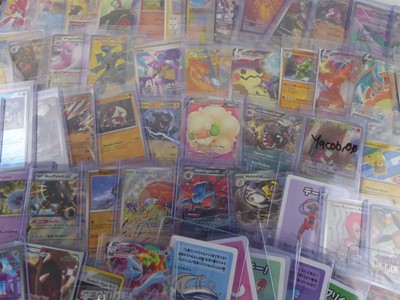Lot Qty of Assorted Top Loaded Pokémon Cards to...