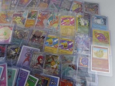 Lot Qty of Assorted Top Loaded Pokémon Cards to...