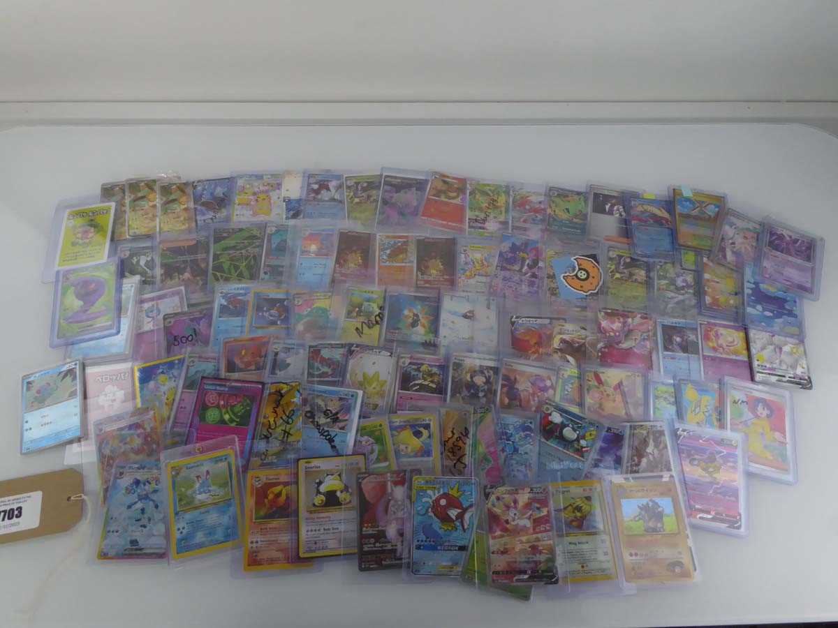 Lot Qty of Assorted Top Loaded Pokémon Cards to...