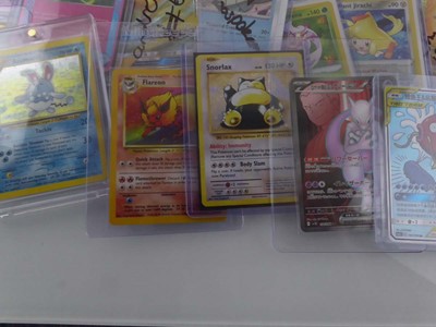 Lot Qty of Assorted Top Loaded Pokémon Cards to...