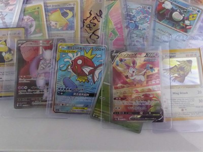 Lot Qty of Assorted Top Loaded Pokémon Cards to...