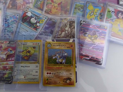 Lot Qty of Assorted Top Loaded Pokémon Cards to...