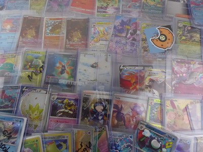 Lot Qty of Assorted Top Loaded Pokémon Cards to...