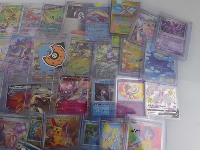 Lot Qty of Assorted Top Loaded Pokémon Cards to...