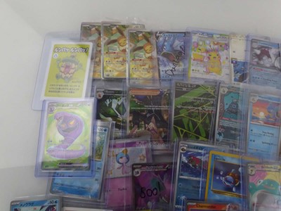 Lot Qty of Assorted Top Loaded Pokémon Cards to...