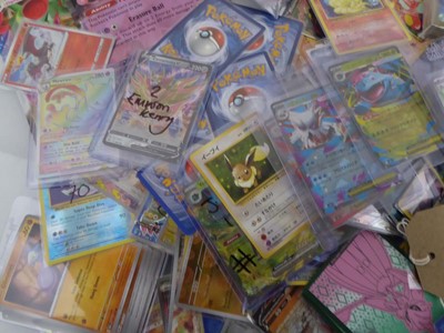 Lot Qty of Sleeved and Top Loaded Pokémon Cards to...