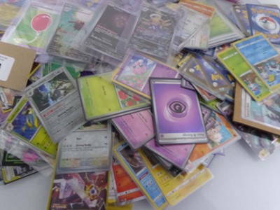 Lot Qty of Sleeved and Top Loaded Pokémon Cards to...