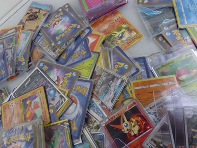 Lot Qty of Sleeved and Top Loaded Pokémon Cards to...