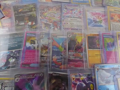 Lot Assortment of Sleeved & Top Loaded Pokémon...