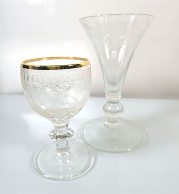Lot 210 - Two hand-blown etched glass drinking vessels,...